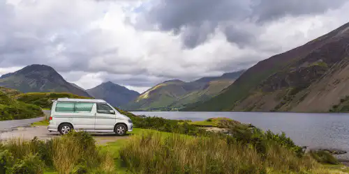 A campervan beside a lake in Scotland