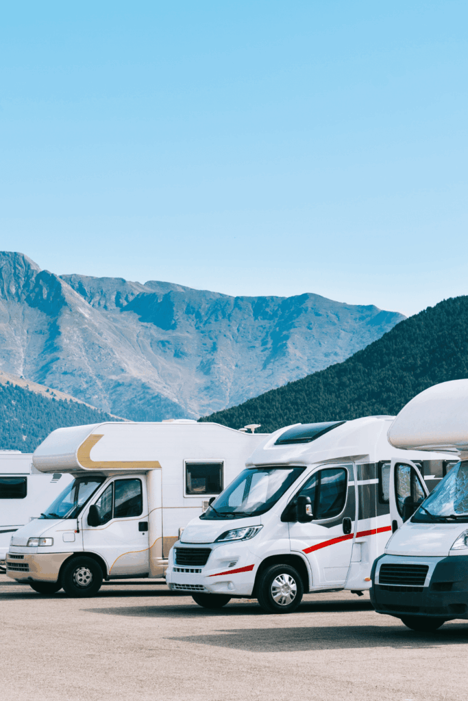 motorhomes lined up in a row in a carpark in Scotland