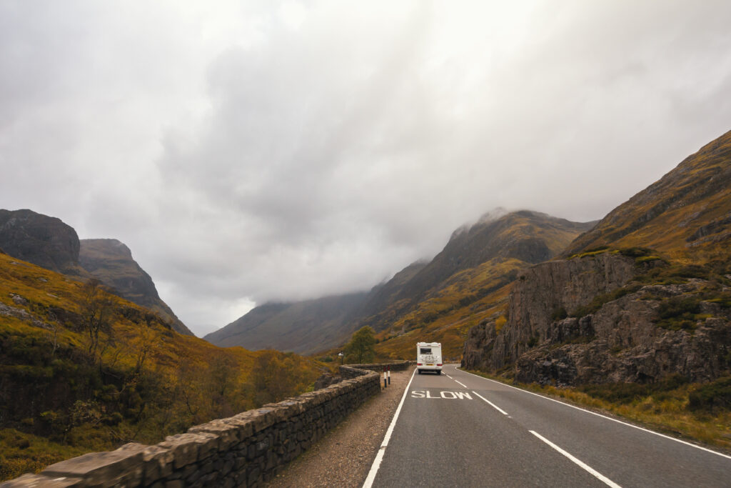 A motorhome on a road in Scotland in fog