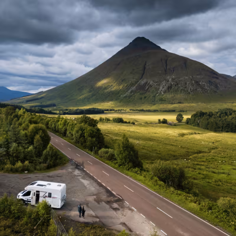 Tourists in a motorhome on the A82 road as it passes Bridge of Orchy in the Scottish highlands.