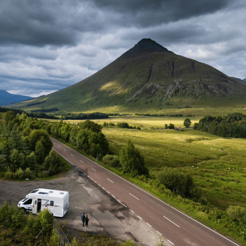 Tourists in a motorhome on the A82 road as it passes Bridge of Orchy in the Scottish highlands.